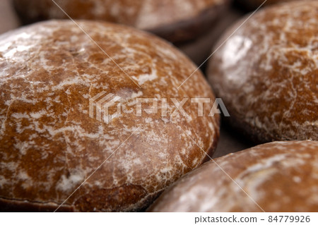 Chocolate gingerbread cookies with a textured surface. Macro. Christmas biscuit 84779926