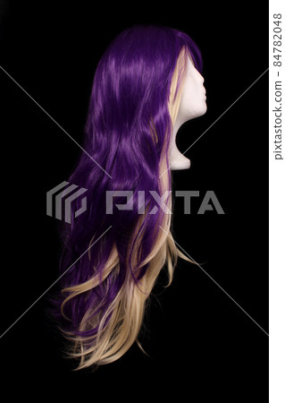 Purple and Blond Wig on Black Background Purple and Blond Wig on Black Background 84782048