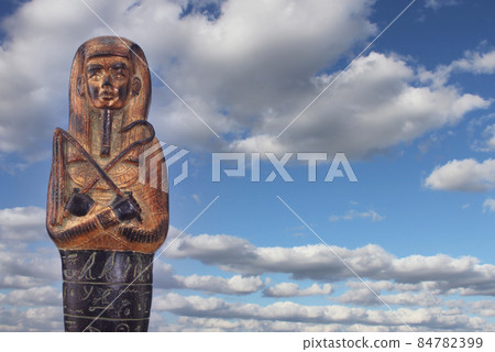 Egyptian Pharaoh Statue with Hieroglyphics and Blue Sky 84782399