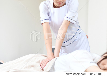 Esthetician female (therapist) doing manipulative massage Esthetician female (therapist) doing manipulative massage 84784819