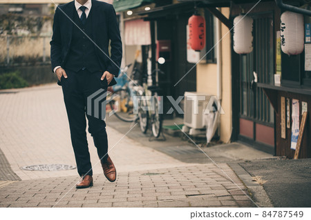 Men walking in a bar in a suit Men walking in a bar in a suit 84787549