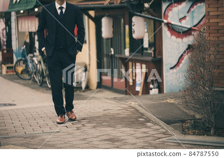 Men walking in a bar in a suit Men walking in a bar in a suit 84787550