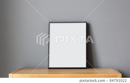 empty frame on wooden shelf 84791022