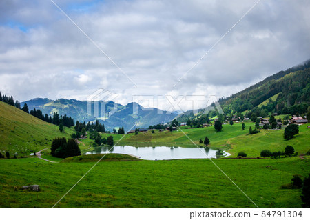 Lake of the Confins and Mountain landscape in La Clusaz, France 84791304