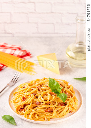 Homemade pasta with pancetta, egg, hard parmesan cheese and cream sauce Homemade pasta with pancetta, egg, hard parmesan cheese and cream sauce 84791756