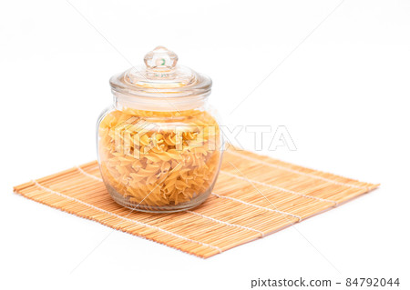 Uncooked Fusilli Pasta in Glass Jar 84792044