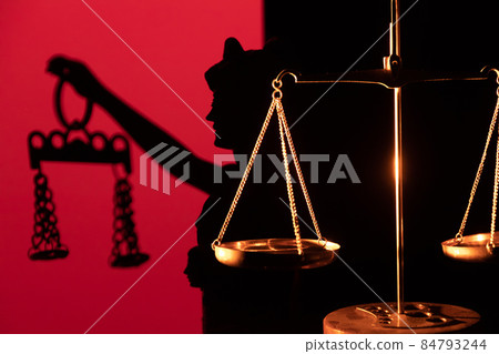 Legal law concept image Scales of Justice and case books on desk. 84793244