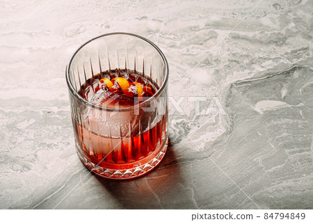 Closeup negroni cocktail in old fashion glass Closeup negroni cocktail in old fashion glass 84794849