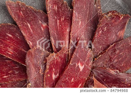 Sliced dry meat basturma appetizer Sliced dry meat basturma appetizer 84794988
