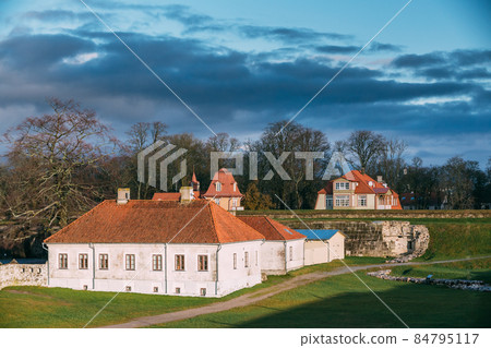 Kuressaare, Saaremaa Island, Estonia. Old House Building Near Episcopal Castle In Evening. Traditional Medieval Architecture, Famous Attraction Landmark 84795117