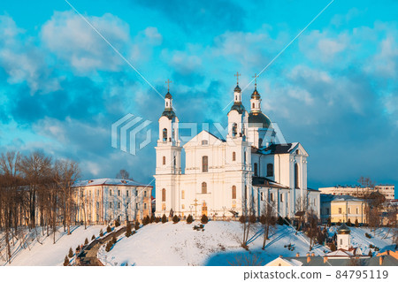 Vitebsk, Belarus. Famous Landmark Is Assumption Cathedral Church In Upper Town On Uspensky Mount Hill And Pushkin Bridge In Sunny Winter Day 84795119