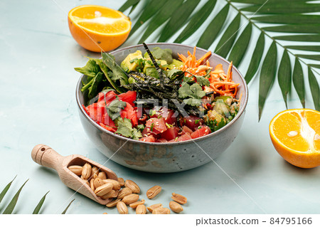 Hawaiian tuna poke bowl with rice and vegetables 84795166