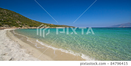 Deserted beach with turquoise and transparent sea between the "Desert des Agriates" and Saint Florent on the west coast of Corsica in spring. Deserted beach with turquoise and transparent sea between the "Desert des Agriates" and Saint Florent on the west coast of Corsica in spring. 84796415