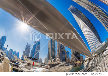 Dubai Marina with luxury boats against skyscrapers in Dubai, United Arab Emirates Dubai Marina with luxury boats against skyscrapers in Dubai, United Arab Emirates 84797435