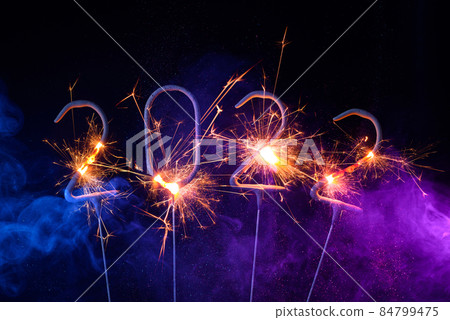 2022 Happy new year greeting card with with sparklers shiny glitter and colorful smoke 2022 Happy new year greeting card with with sparklers shiny glitter and colorful smoke 84799475