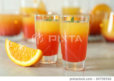 Tequila sunrise cocktails on white textured table, close up Tequila sunrise cocktails on white textured table, close up 84799588