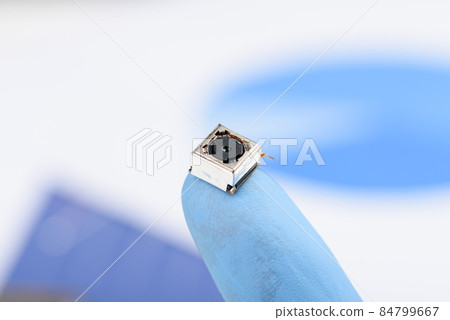 Smartphone camera module on a fingertip 84799667