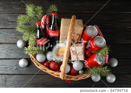 Odessa, Ukraine - November 10, 2021: Concept of gift with Christmas basket on dark background 84799758
