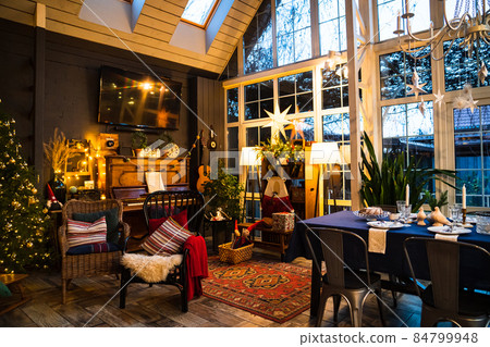interior in vintage style with retro furniture, piano and garlands in evening.  84799948