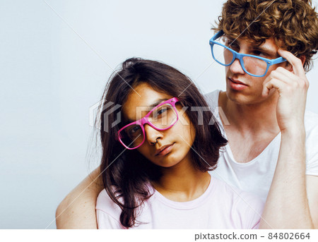 best friends teenage girl and boy together having fun, posing emotional on white background, couple happy smiling, lifestyle people concept, blond and brunette multi nations 84802664