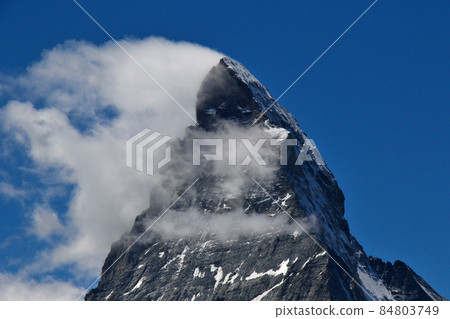 The tip of the independent peak Matterhorn that shines in the blue sky The tip of the independent peak Matterhorn that shines in the blue sky 84803749