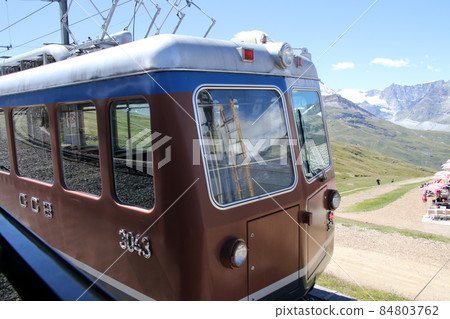 Gornergrat Railway vehicle with the independent peak Matterhorn shining in the blue sky Gornergrat Railway vehicle with the independent peak Matterhorn shining in the blue sky 84803762