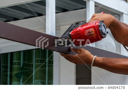 Pneumatic nails gun shooting Pneumatic nails gun shooting 84804178