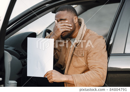 Black man with impression of embarrassment on his face Black man with impression of embarrassment on his face 84804791