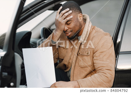 Black man with impression of embarrassment on his face Black man with impression of embarrassment on his face 84804792
