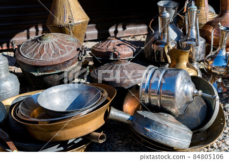 Close up of antique brass jugs and dishes Close up of antique brass jugs and dishes 84805106