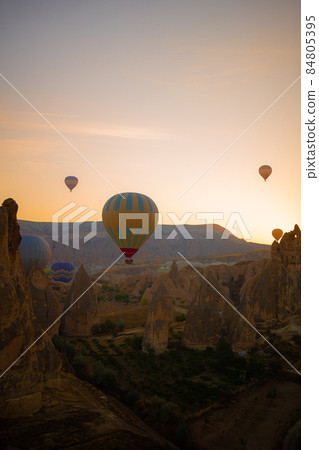 Bright hot air balloons in sky of Cappadocia, Turkey Bright hot air balloons in sky of Cappadocia, Turkey 84805395