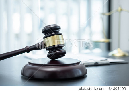 Judge gavel with Justice at law firm in background with legal case document contract, law and justice, attorney, lawsuit Judge gavel with Justice at law firm in background with legal case document contract, law and justice, attorney, lawsuit 84805403