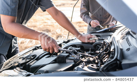Technician team working of car mechanic in doing auto repair service and maintenance worker repairing vehicle with wrench, Service and Maintenance car check 84805437