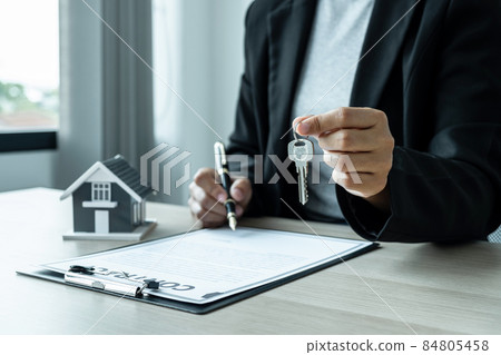 Sale Estate agent giving house model and key to new client after signing agreement contract with approved property form, Home Insurance and Real estate investment concept Sale Estate agent giving house model and key to new client after signing agreement contract with approved property form, Home Insurance and Real estate investment concept 84805458