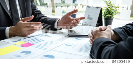 Two business partner team meeting and discussion financial project of investment ideas, presentation and analyzing marketing planning strategy of business making to growth profit and successful 84805459