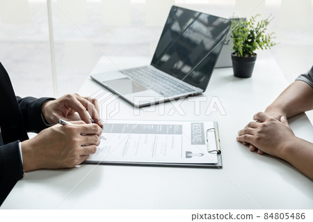 Businessman interview consider a resume conversation during about profile of candidate of conducting a job interview listen to answers while sitting at the working meeting in office Businessman interview consider a resume conversation during about profile of candidate of conducting a job interview listen to answers while sitting at the working meeting in office 84805486