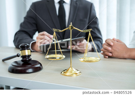 Professional Male lawyer or counselor discussing negotiation legal case with client meeting with document contract in office, law and justice, attorney, lawsuit concept 84805526