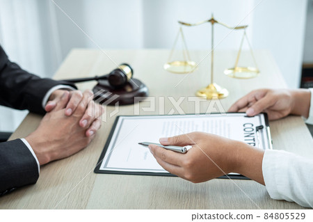 Male lawyer or counselor discussing negotiation legal case with client meeting with document contract in office, law and justice, attorney, lawsuit concept 84805529