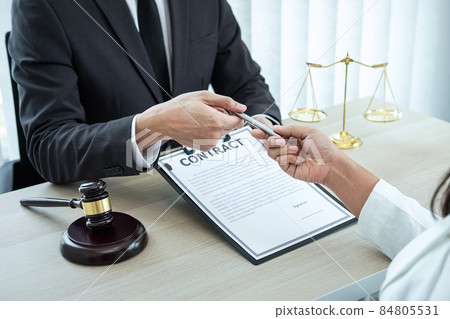 Male lawyer or counselor discussing negotiation legal case with client meeting with document contract in office, law and justice, attorney, lawsuit concept 84805531