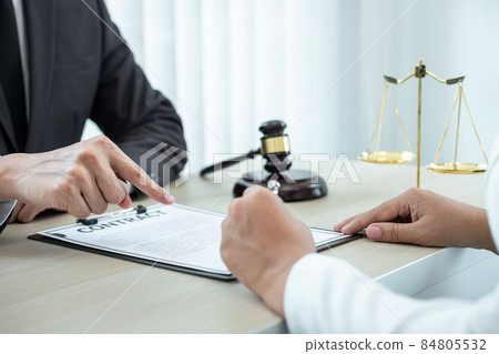 Professional Male lawyer or counselor discussing negotiation legal case with client meeting with document contract in office, law and justice, attorney, lawsuit concept 84805532