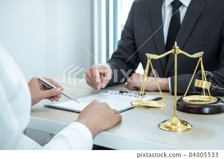 Male lawyer or counselor discussing negotiation legal case with client meeting with document contract in office, law and justice, attorney, lawsuit concept 84805533