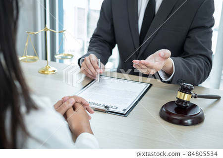 Professional Male lawyer or counselor discussing negotiation legal case with client meeting with document contract in office, law and justice, attorney, lawsuit concept 84805534