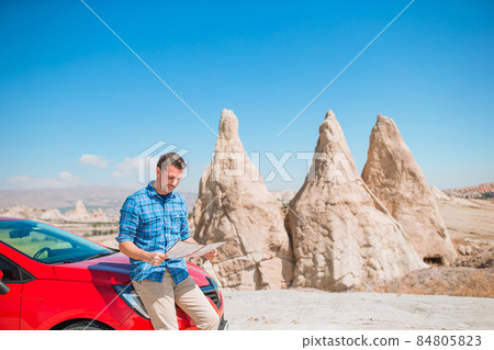 Happy man on summer vacation in famous place. Cave formations. 84805823