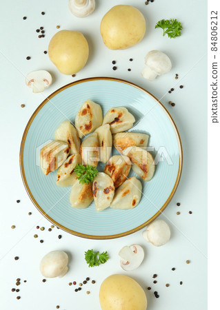 Concept of tasty food with vareniki or pierogi on white background Concept of tasty food with vareniki or pierogi on white background 84806212