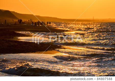 Close up of sea water runs onto the sandy shore. 84807588
