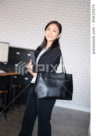 Portrait of a beautiful sales female staff vertical Portrait of a beautiful sales female staff vertical 84810974