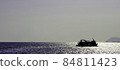 Silhouette of a fishing boat passing the sea off Haeundae, Busan in the late afternoon 84811423