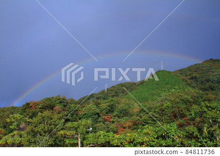 Rainbow, a rainbow over the mountain ridge in autumn Rainbow, a rainbow over the mountain ridge in autumn 84811736