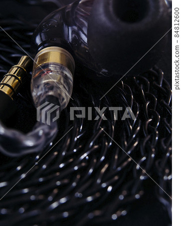 macro of in ear monitors with braided cables 84812600