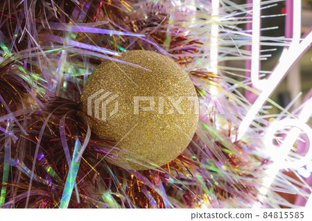 Happy New Year Christmas tree decorates on background bokeh of side flickering light bulbs garlands for family holiday. 84815585